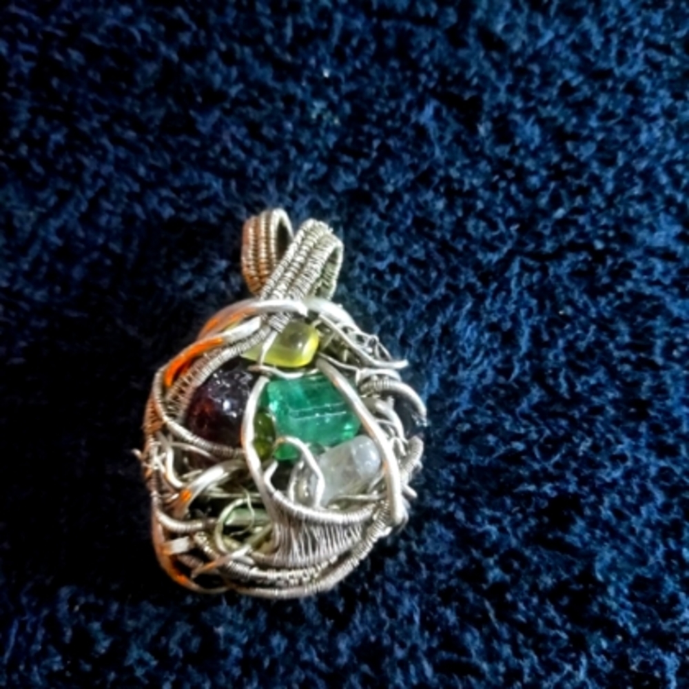 Silver Wire Wrap with Amethyst stones from around the world..Handmade!